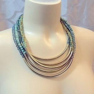 Multi strand green bead and gold necklace. Excellent condition.